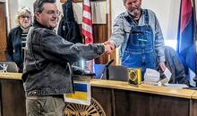 Photo of Saguache County Commissioner, Tom McCracken, presenting David Frees with the "Emergency Manager of the Year" award.